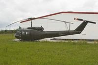 Ex German Huey 73+69 in US Army colours outside Kaisheim